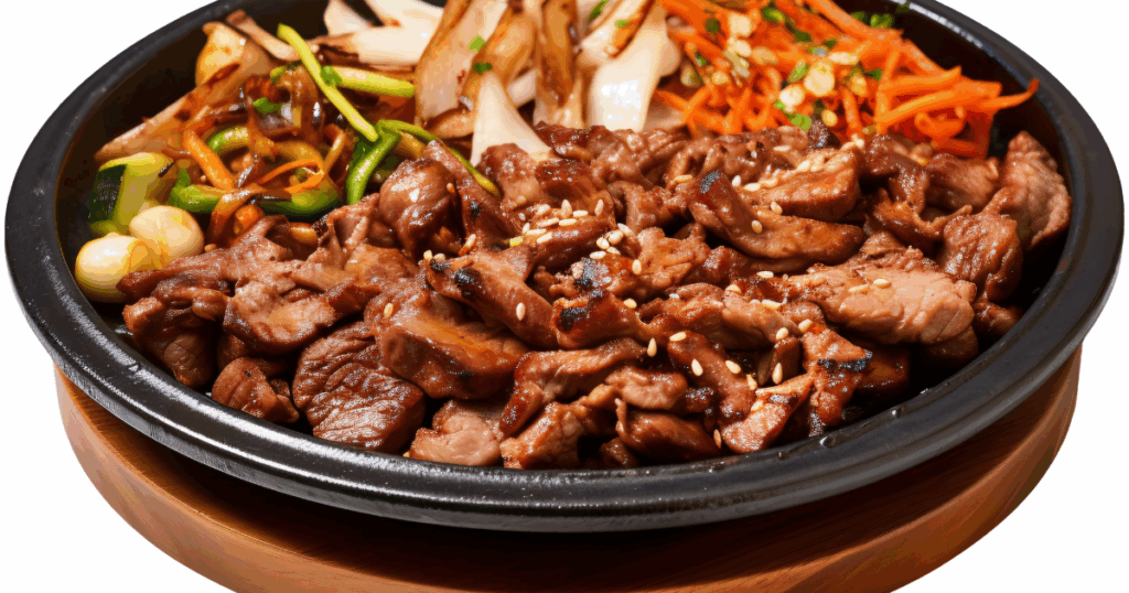 Korean bulgogi beef with grilled vegetables in a black bowl