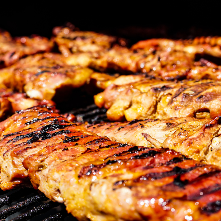 John Mulls Meat Company preparing a smoker with carefully selected wood chips to enhance BBQ flavor.