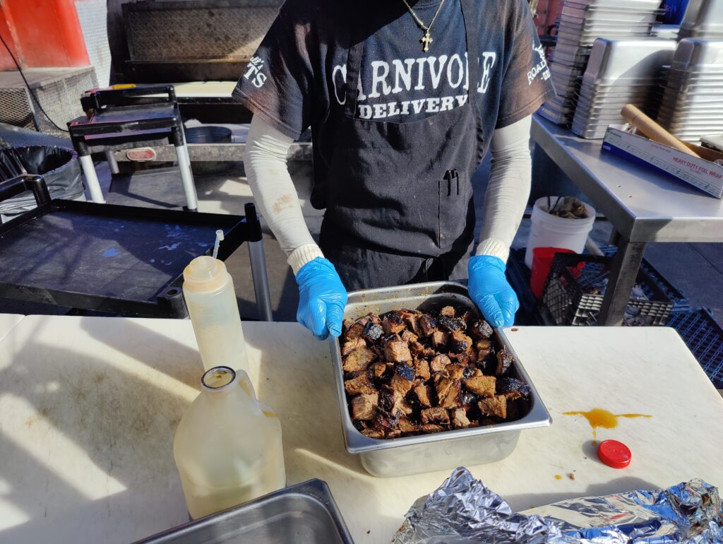 John Mull’s Meats staff preparing burnt ends for BBQ catering event in Las Vegas.