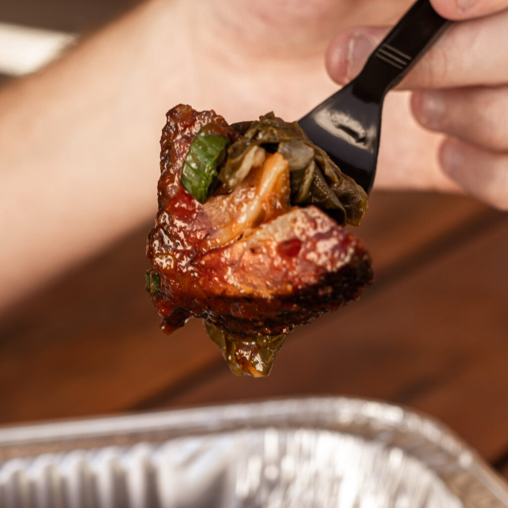 Butcher preparing meat at John Mull’s Meats in Las Vegas—quality cuts for BBQ