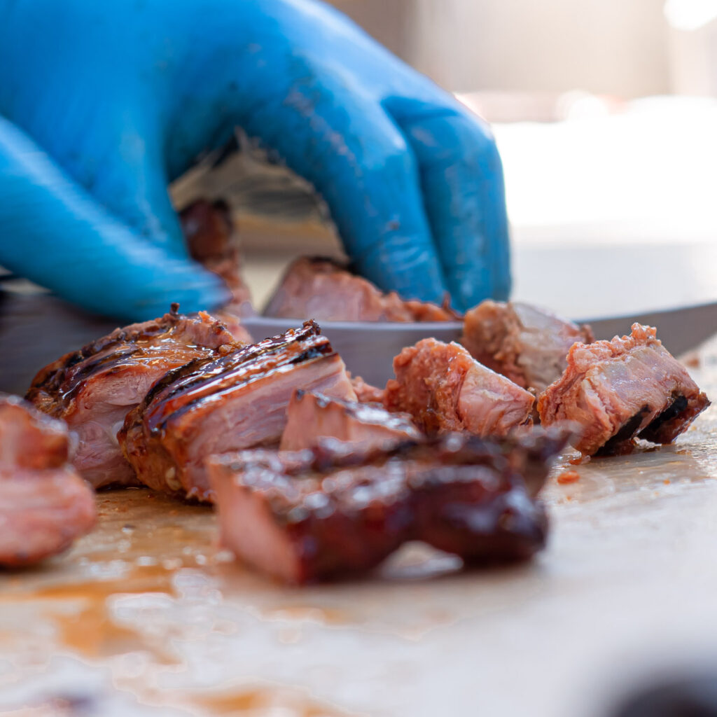 Hand-sliced smoked brisket at John Mull’s Meats, a BBQ joint featured on national TV