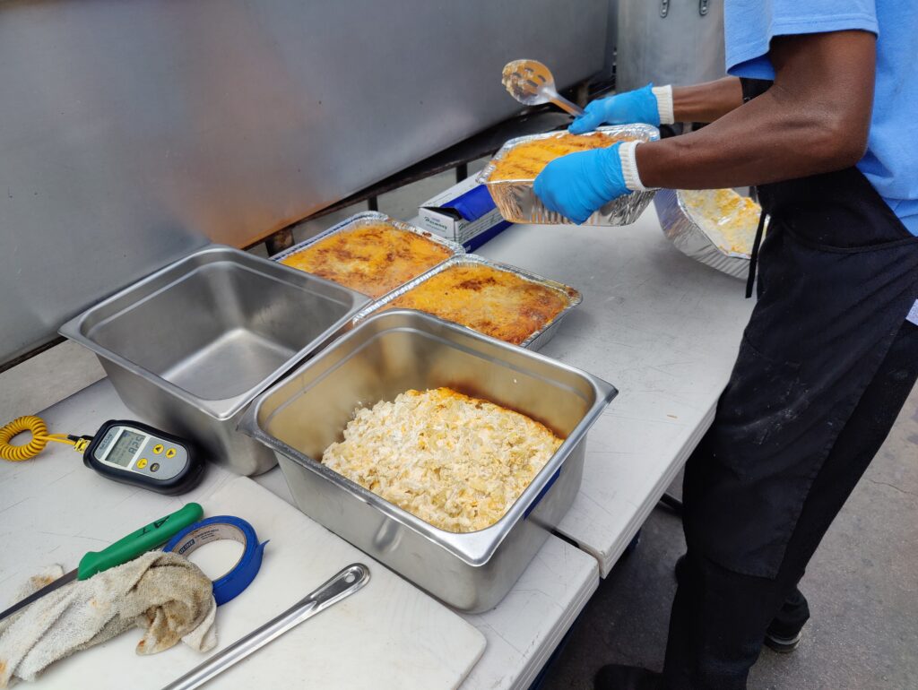 Preparing the perfect BBQ mac and cheese sides at John Mull’s Meats in Las Vegas