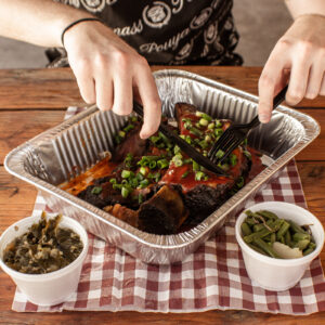 Close-up of BBQ beef ribs with sauce and green onions at Road Kill Grill in Las Vegas