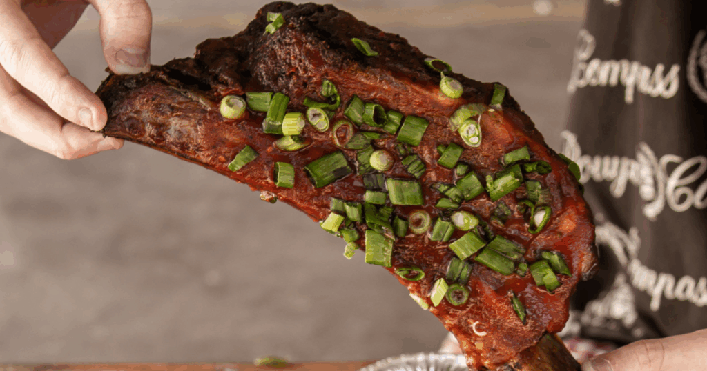Slow-smoked barbecue ribs topped with green onions at John Mull’s Meats & Road Kill Grill, a hidden BBQ destination in Northern Las Vegas