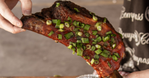 slow-smoked BBQ rib with sauce and green onions Las Vegas BBQ