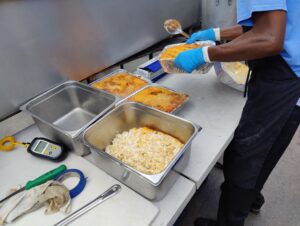 BBQ catering side dishes from John Mull’s Road Kill Grill, including mac and cheese and coleslaw for Las Vegas events.
